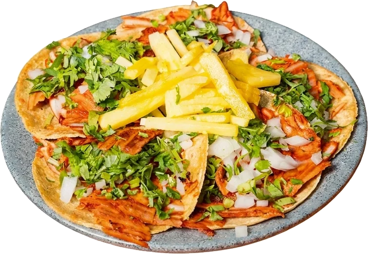 Orden de tacos al pastor con piña en plato de peltre azul
